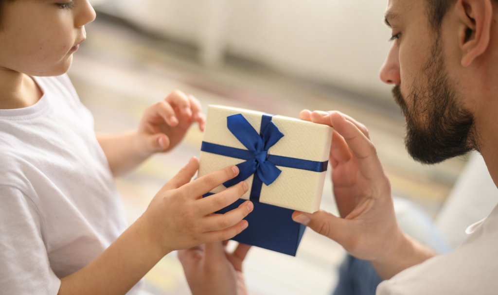 close-up-kid-offering-present.jpg close-up-kid-offering-present.jpg