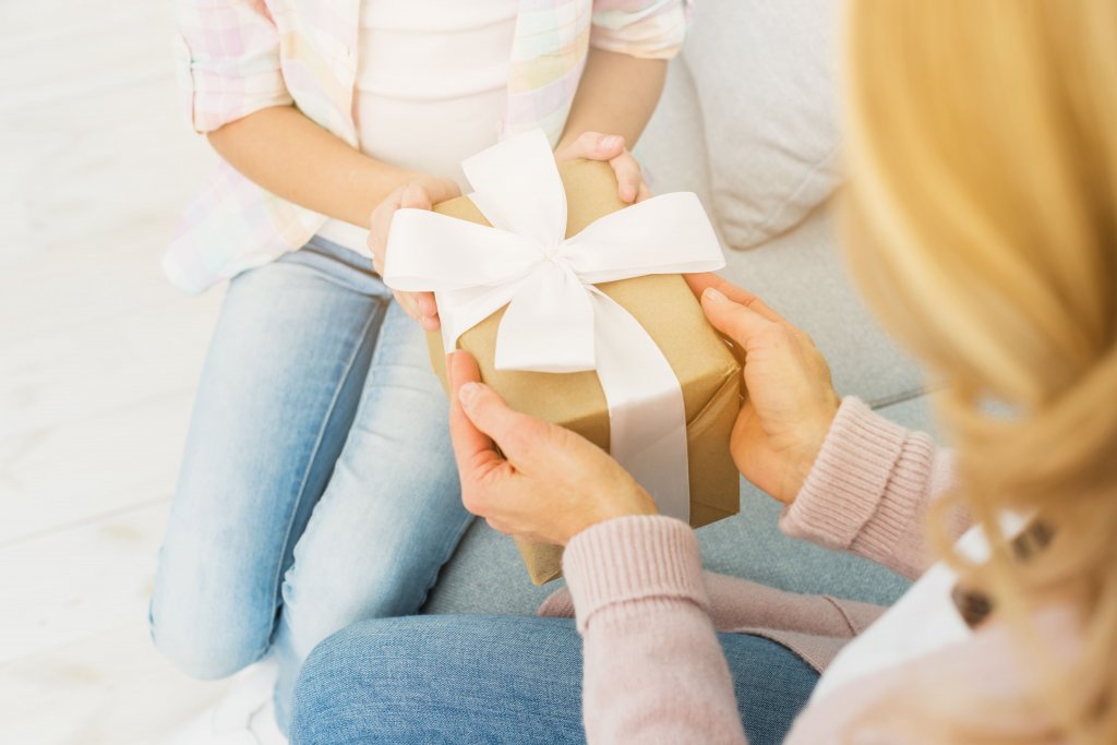 gift-box-in-hands-of-mother-and-daughter (1).jpg gift-box-in-hands-of-mother-and-daughter (1).jpg