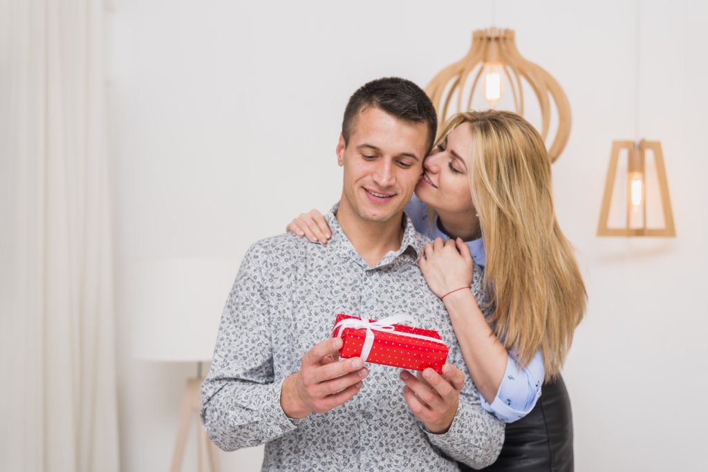happy-lady-embracing-young-guy-with-present.jpg happy-lady-embracing-young-guy-with-present.jpg